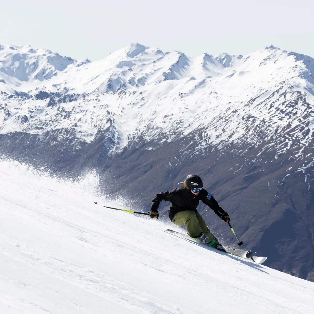 Promotional graphic of a skier blasting through powder with the headline “The best gift? Winter.” for a ski resort campaign.